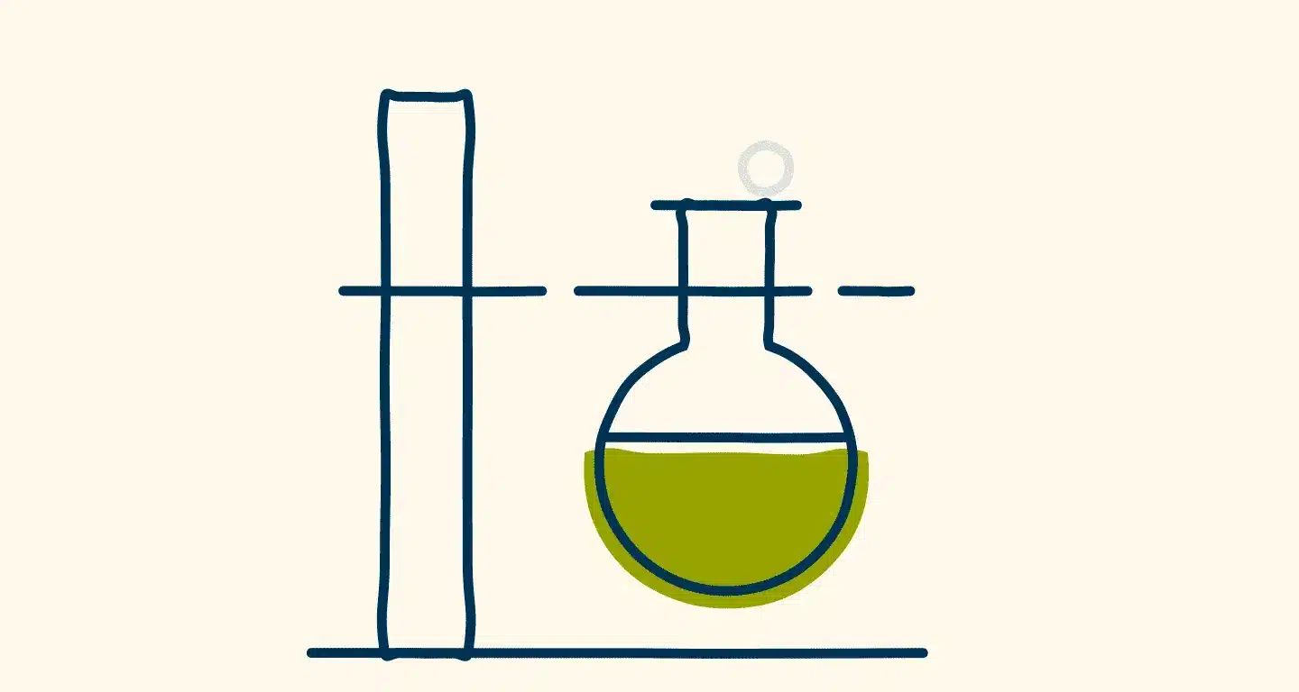 Simple line drawing of a test tube and a round-bottom flask containing green liquid, both held upright on a laboratory stand.