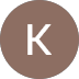 A brown circle with a white letter "K" in the center, resembling a simple icon or profile image.